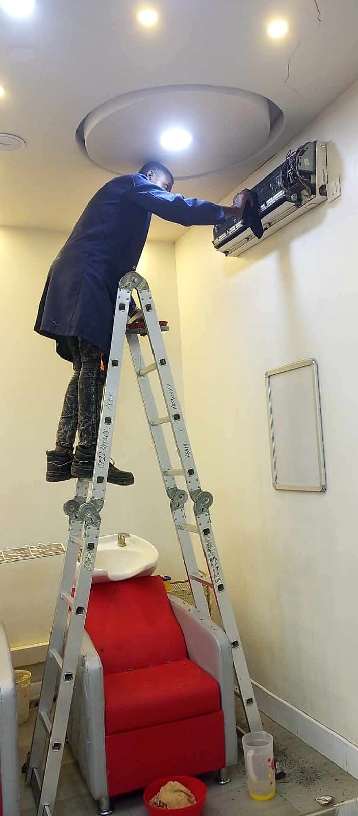 Technician working on an air-conditioning unit